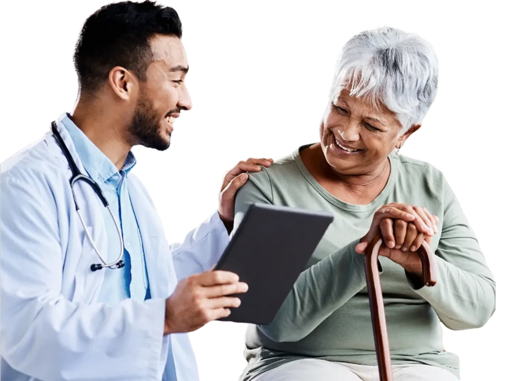 A doctor converses with an older woman in a medical office, discussing her health and treatment options.