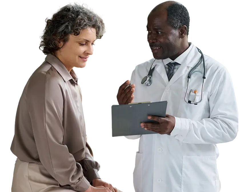 A doctor discussing health concerns with a patient in a clinical setting.