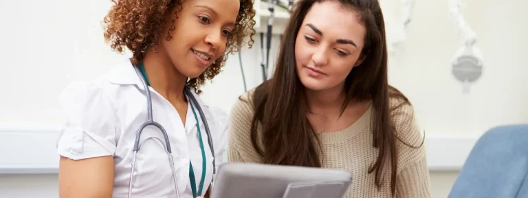 Nurse and Patient in Exam Room