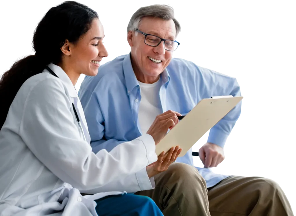 A doctor and patient reviewing information together on a tablet in a clinical setting.